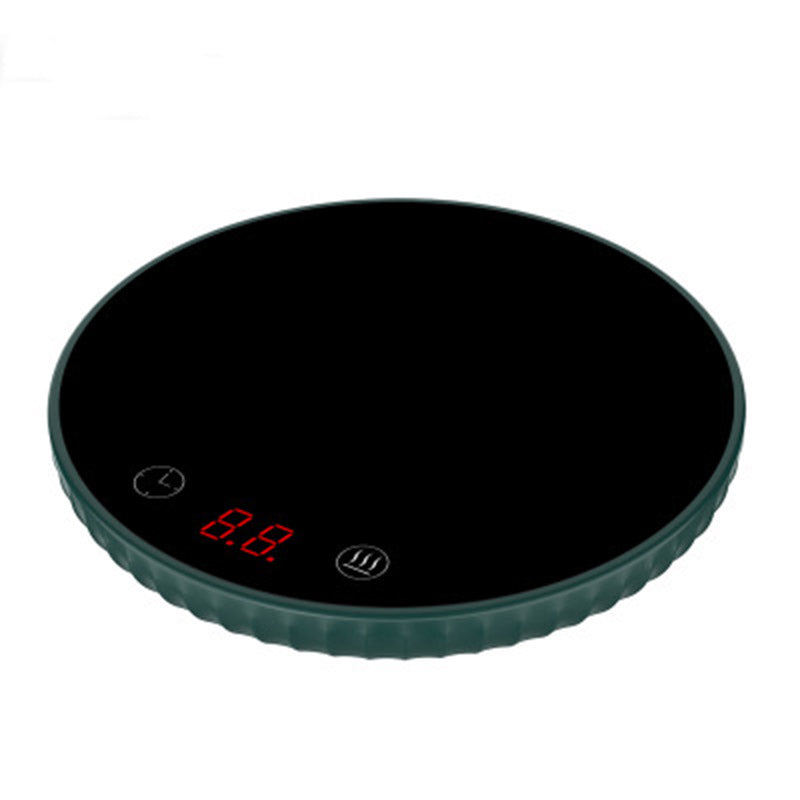 Black digital kitchen scale on a white background