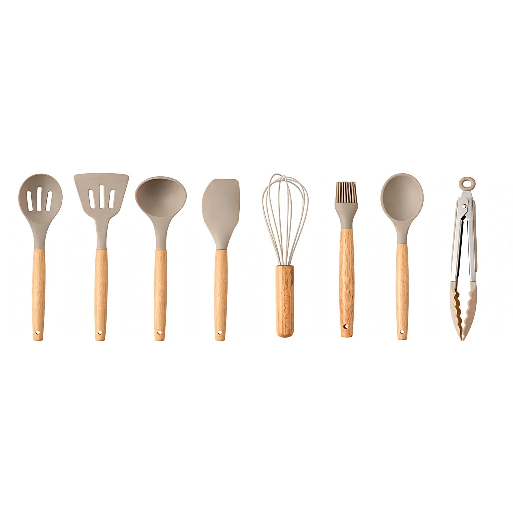 Row of eight khaki silicone utensils with wooden handles on white: spoons, turners, ladle, spatula, whisk, brush and tongs