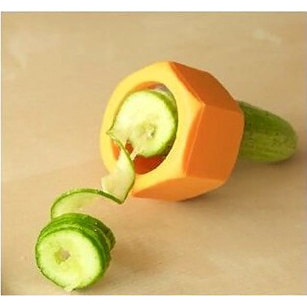Orange spiral cutter resting on a beige surface with freshly sliced cucumber rounds beside it