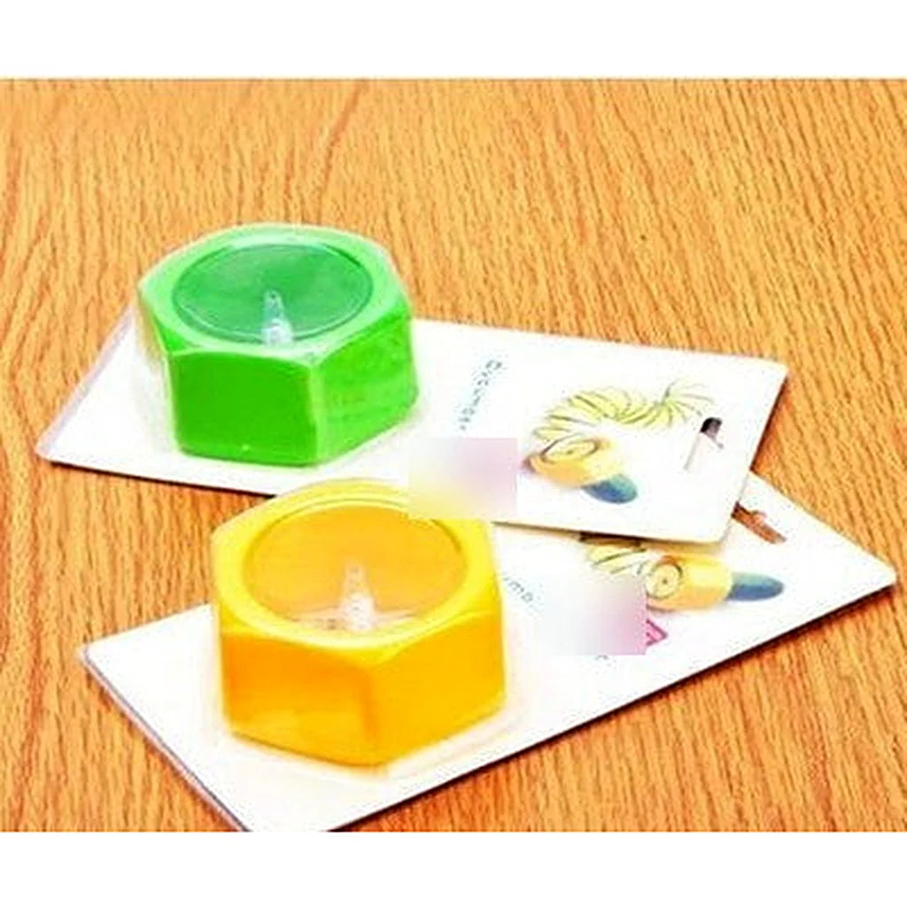 Green and yellow spiral cutters in their retail card packaging on a light wood table