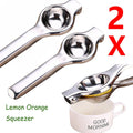 Two stainless steel lemon squeezers on a white background, one pressing a lemon half over a white mug