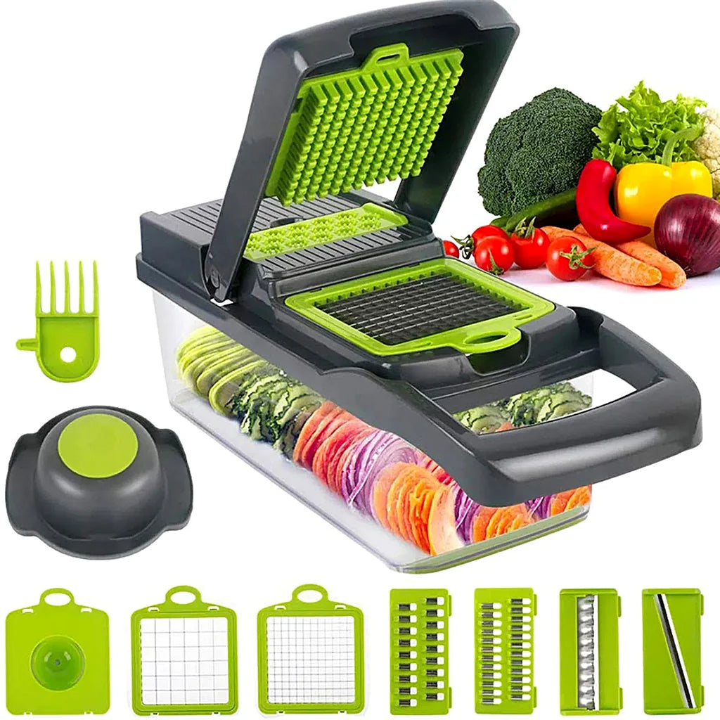 Grey and green vegetable chopper with blade inserts and hand guard, fresh broccoli, peppers and carrots in the background