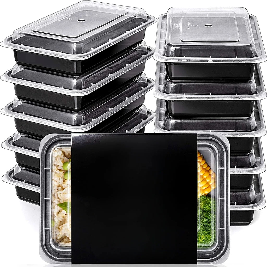 Two stacks of black meal prep containers with clear lids, and one in front filled with rice, corn and broccoli