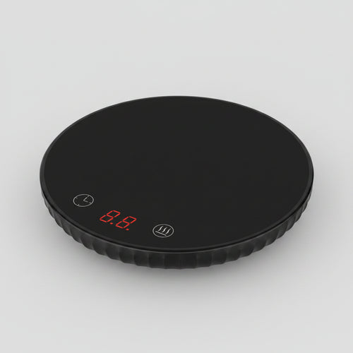 Black digital kitchen scale with a digital display on a white background