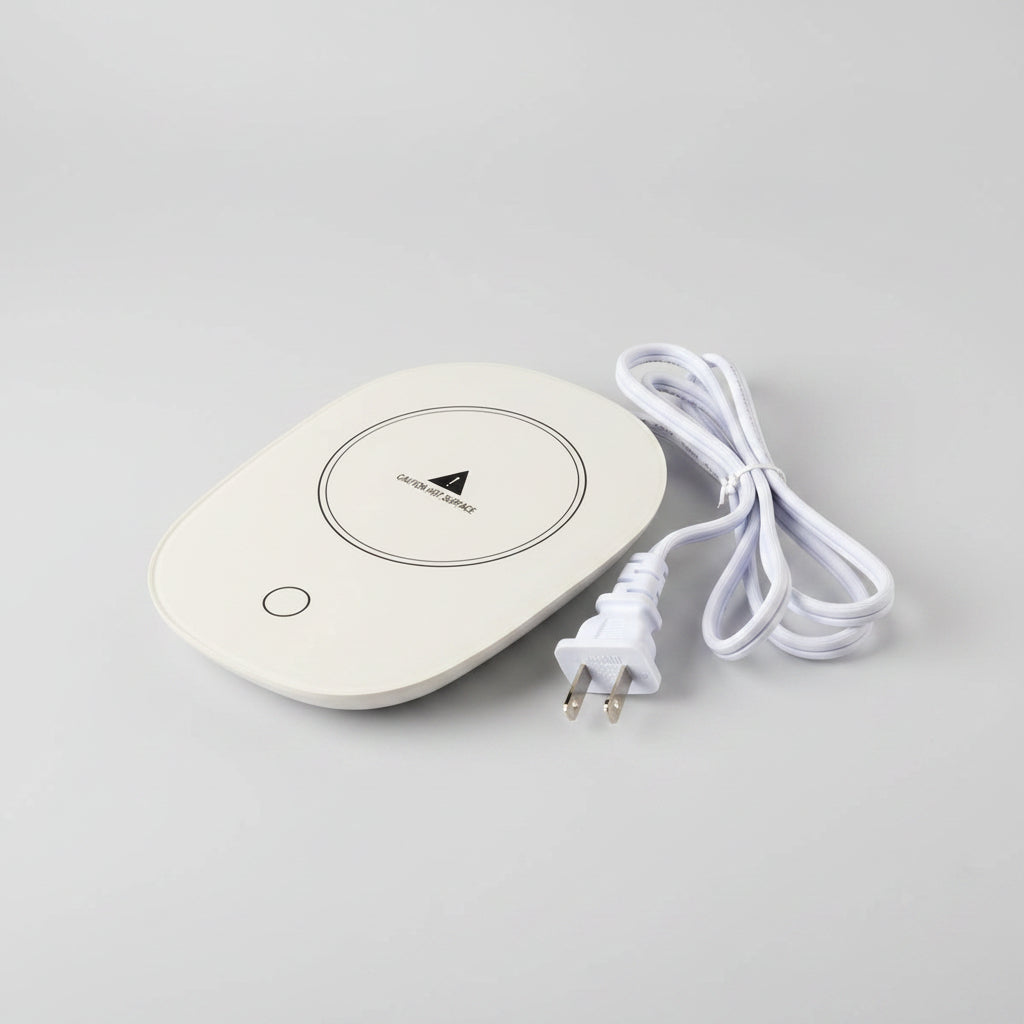 White heating pad with a plug on a white background