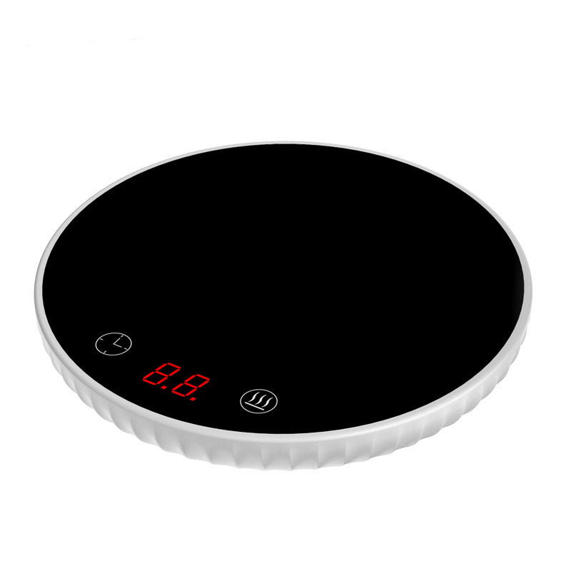 Black electric hot plate with digital display on a white background