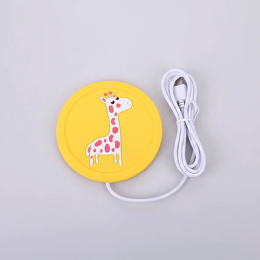 Yellow USB warmer pad with a giraffe design beside its coiled USB cable on a white background