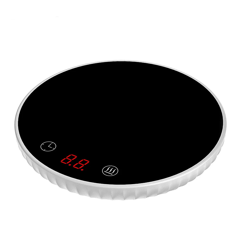 Round mug warmer with a white rim and black glass top on a white background