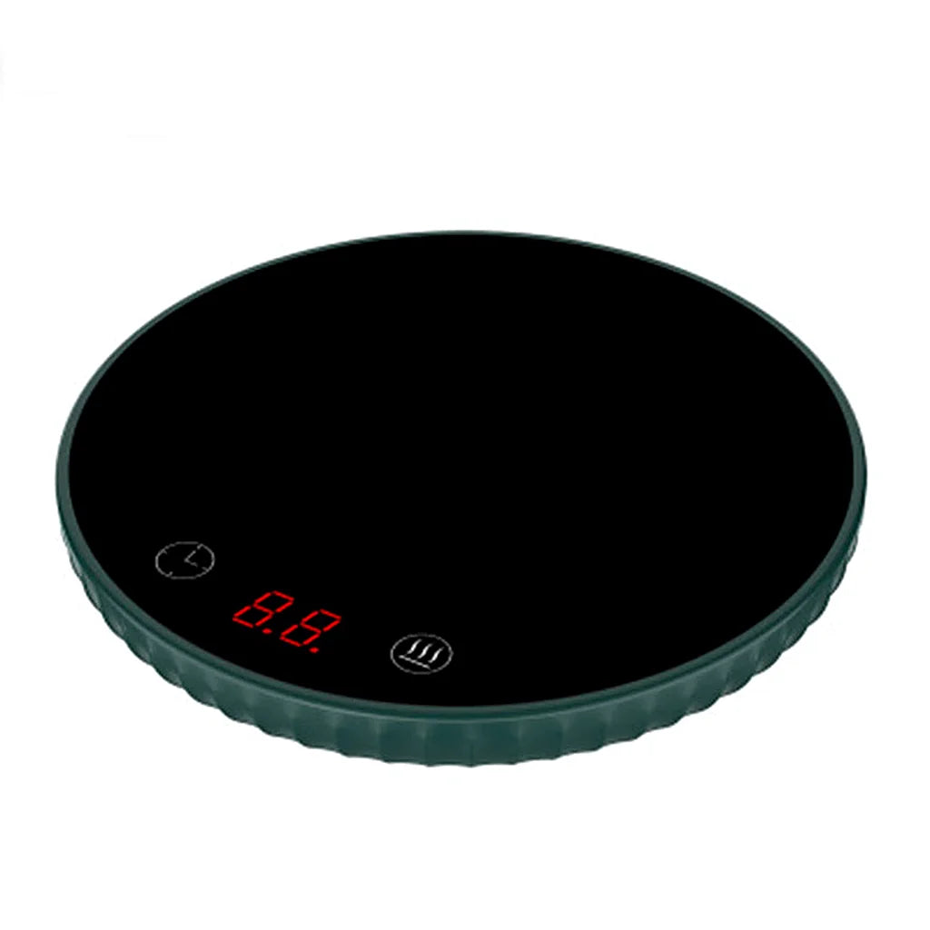 Round mug warmer with a dark green rim and black glass top on a white background