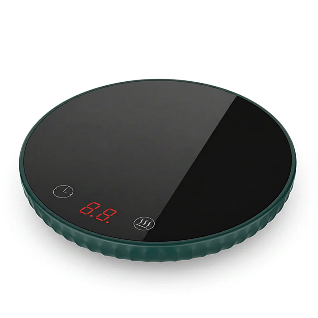 Dark green round mug warmer with a glossy black glass top on a white background